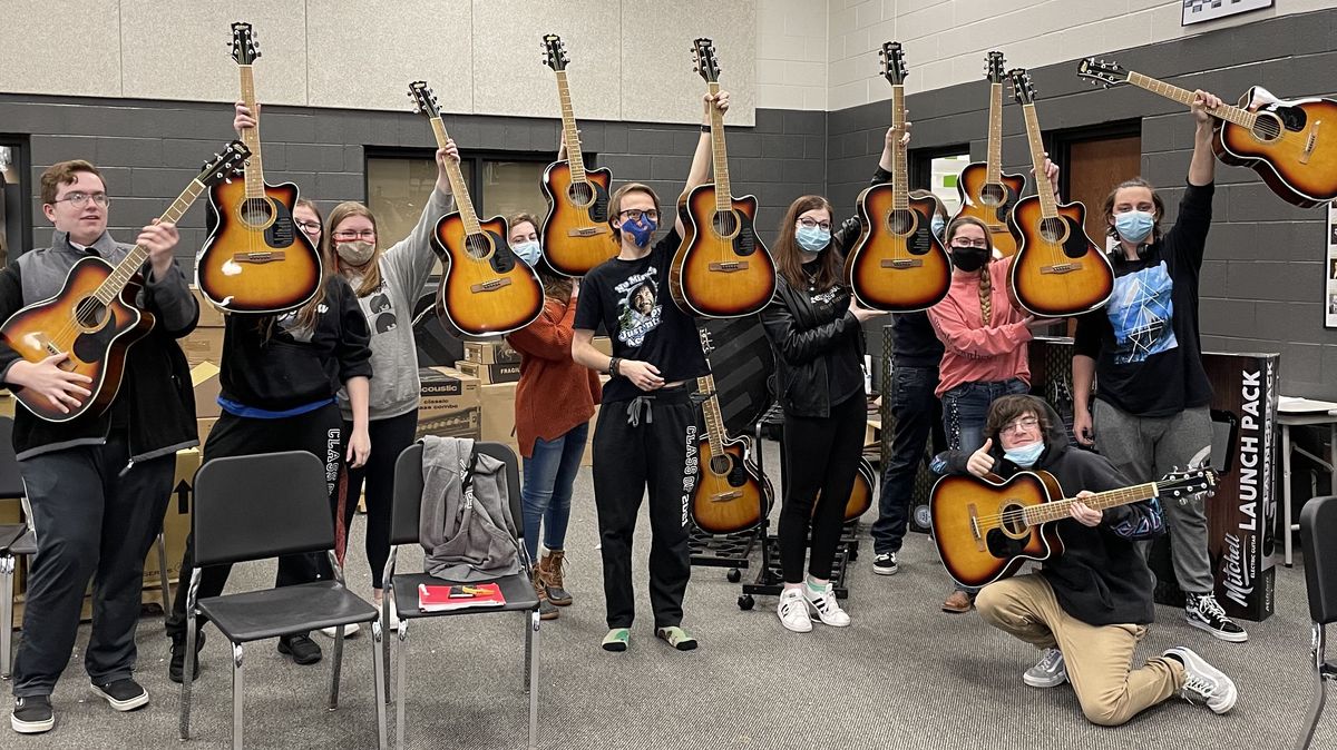 Students from Upperman High School in Baxter, TN, holding their new guitars, the result of a grant from the Guitar Center Music Foundation, who drew from Guitar Center’s in-store and online fundraising initiatives known as the “Round Up Your Change” program.