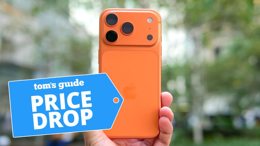 Orange iPhone 17 Pro held in hand