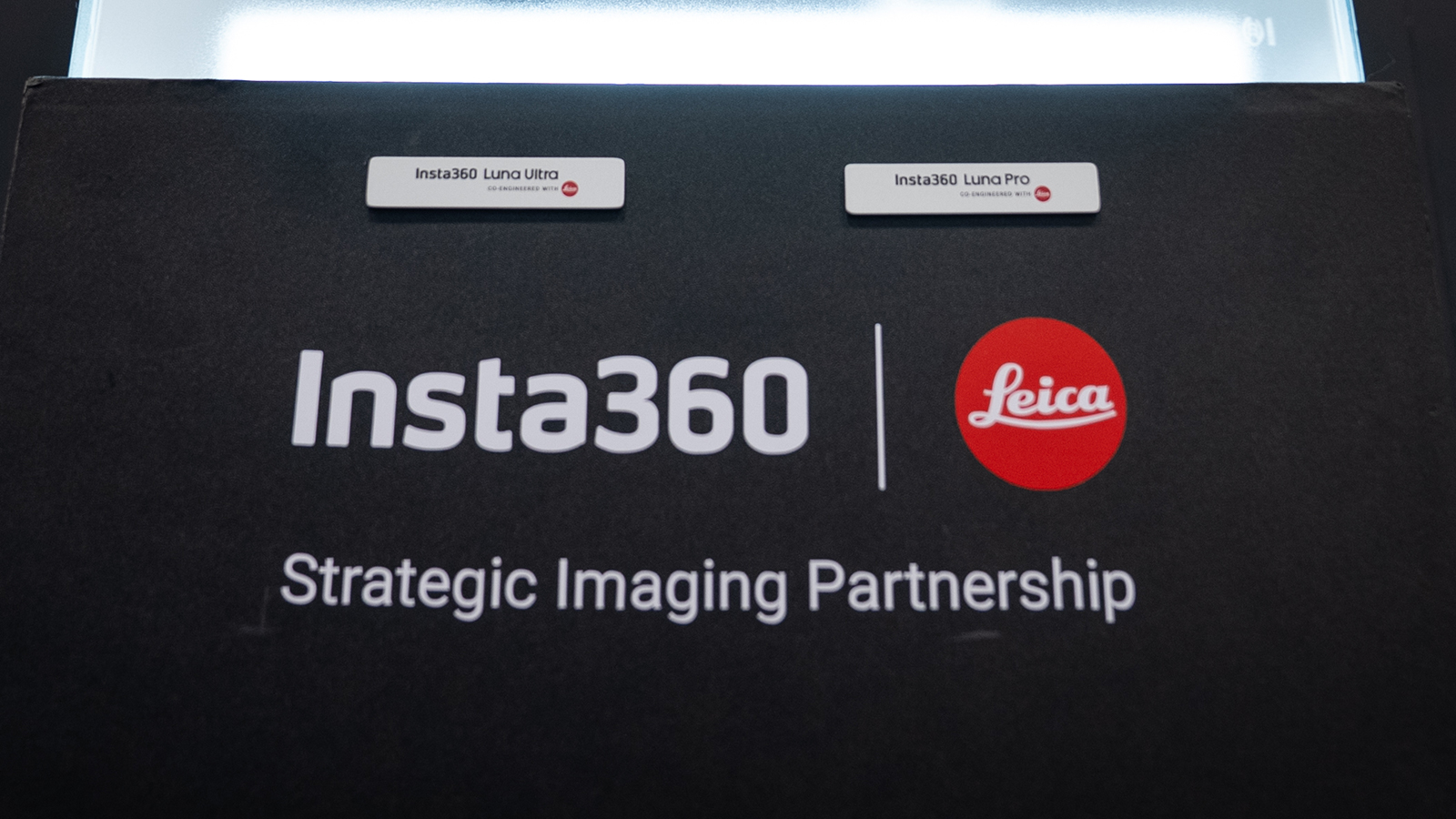 Insta360 Luna cameras behind frosted glass at NAB 2026