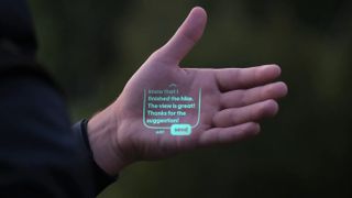The Humane AI Pin projecting onto a hand