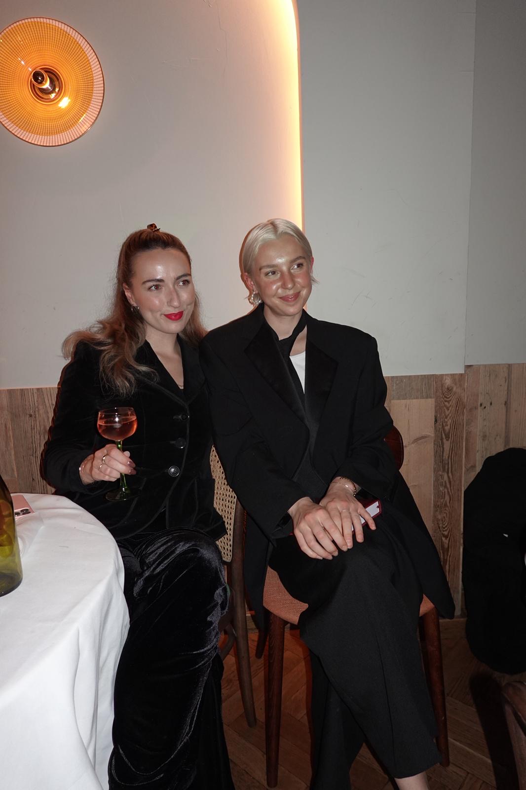 Two women sitting at a dinner
