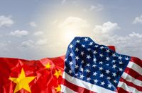 Chinese flag and US flag in front of blue sky