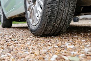 car tyre on gravel driveway