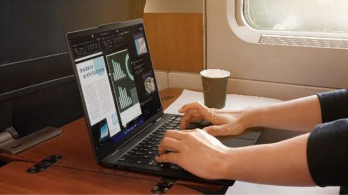 A person typing on a Lenovo ThinkPad X13s