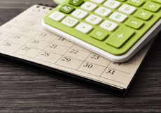 green calculator on calendar