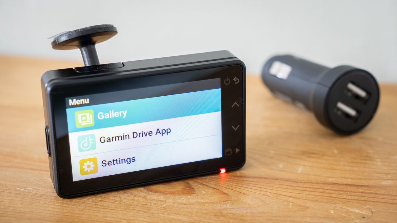 Garmin Dash Cam X110 on a wooden table