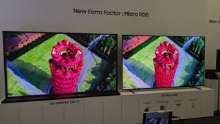 An RGB mini-LED TV (left) next to Samsung's micro-RGB TV showing a red tower 