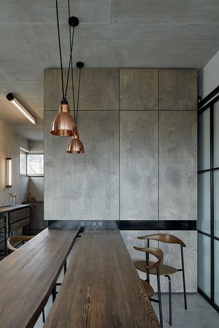 The architect kept the structure’s naked concrete ceilings