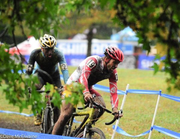Joachim Parbo (Challenge Tires) riding through the trees with Adam Myerson
