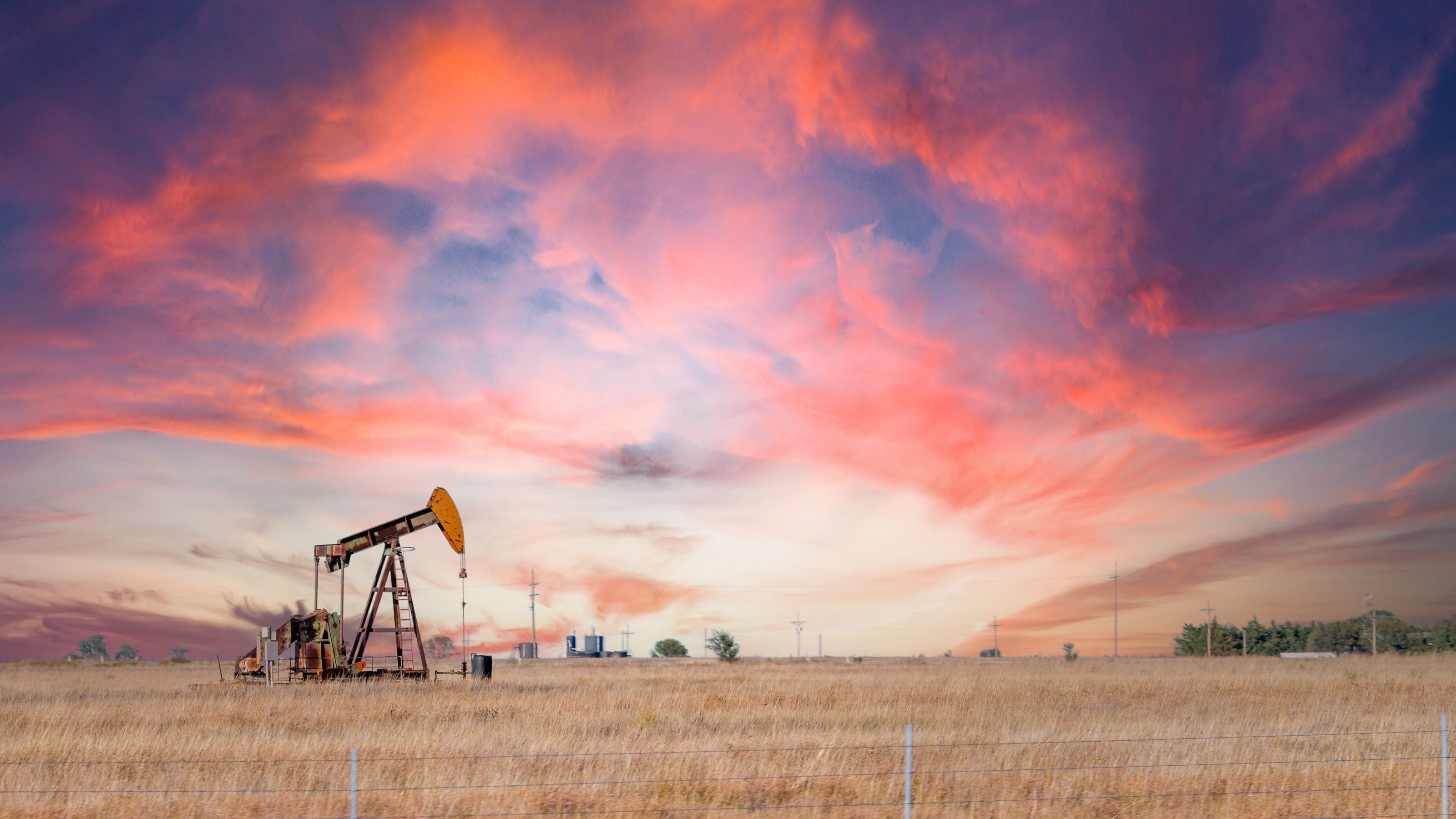 Oil pump in Kansas at sunset.