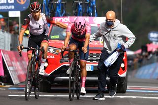 PASSO FEDAIA ITALY MAY 28 LR Davide Formolo of Italy and UAE Team Emirates and Richard Carapaz of Ecuador and Team INEOS Grenadiers Pink Leader Jersey cross the finish line during the 105th Giro dItalia 2022 Stage 20 a 168km stage from Belluno to Marmolada Passo Fedaia 2052m Giro WorldTour on May 28 2022 in Passo Fedaia Italy Photo by Michael SteeleGetty Images