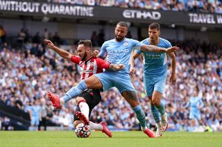 Kyle Walker challenges Southampton’s Adam Armstrong