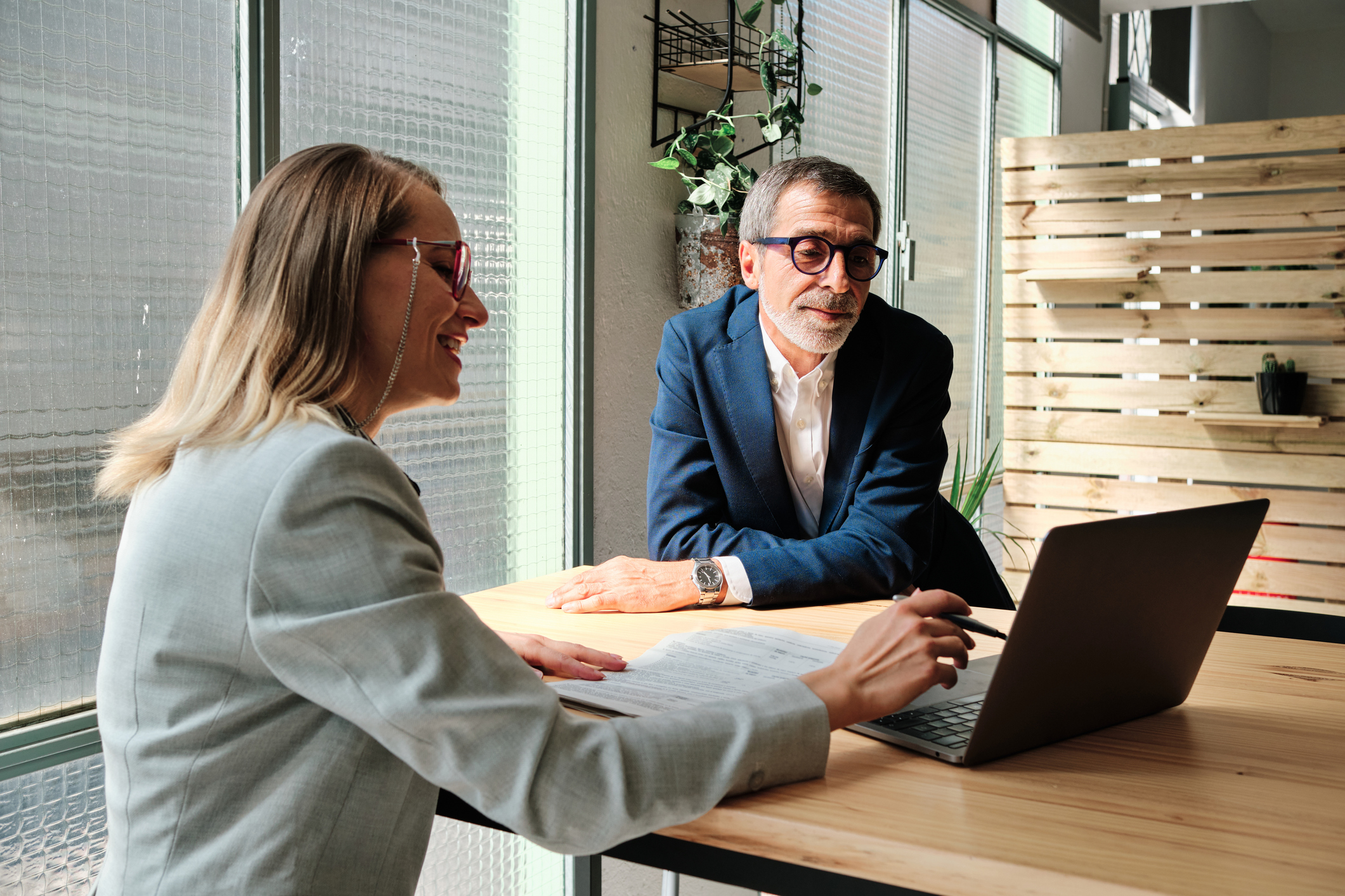 A mortgage broker is discussing refinance options with her client.