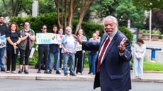 WASHINGTON, D.C. - JUNE 9: Current and former Smithsonian staff and supporters of the arts cheer outside the National Museum of American History for a public demonstration of support for Secretary of the Smithsonian Institution Lonnie G. Bunch III as he arrives for a Board of Regents meeting