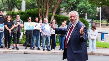 WASHINGTON, D.C. - JUNE 9: Current and former Smithsonian staff and supporters of the arts cheer outside the National Museum of American History for a public demonstration of support for Secretary of the Smithsonian Institution Lonnie G. Bunch III as he arrives for a Board of Regents meeting