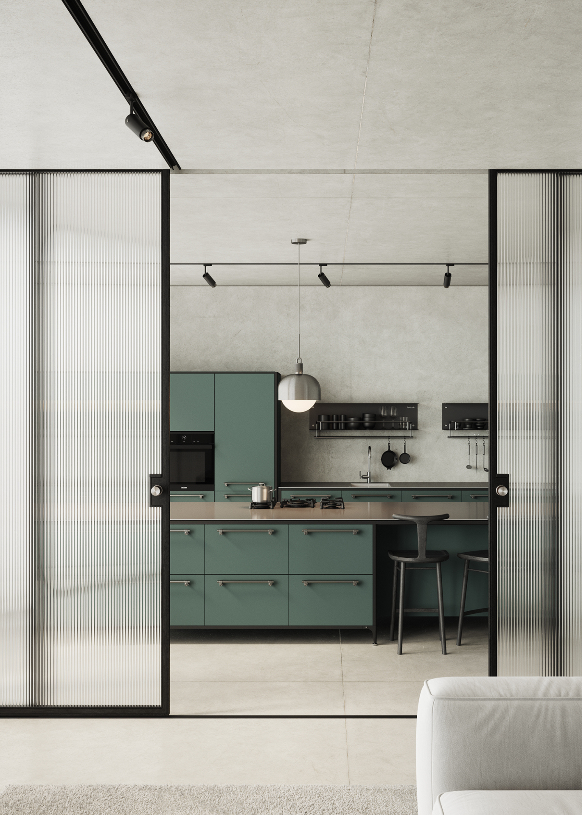 A modern green kitchen set behind large fluted glass sliding doors