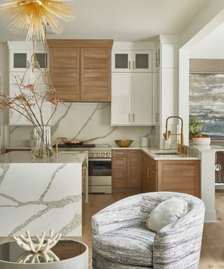 White and wooden kitchen with white marble island