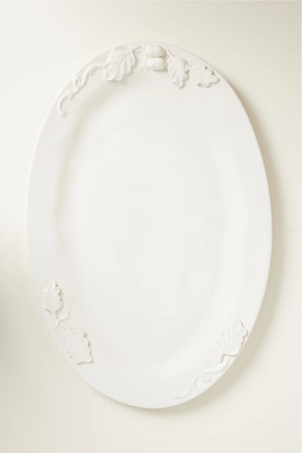 White oval stoneware platter with oak leaf detailing