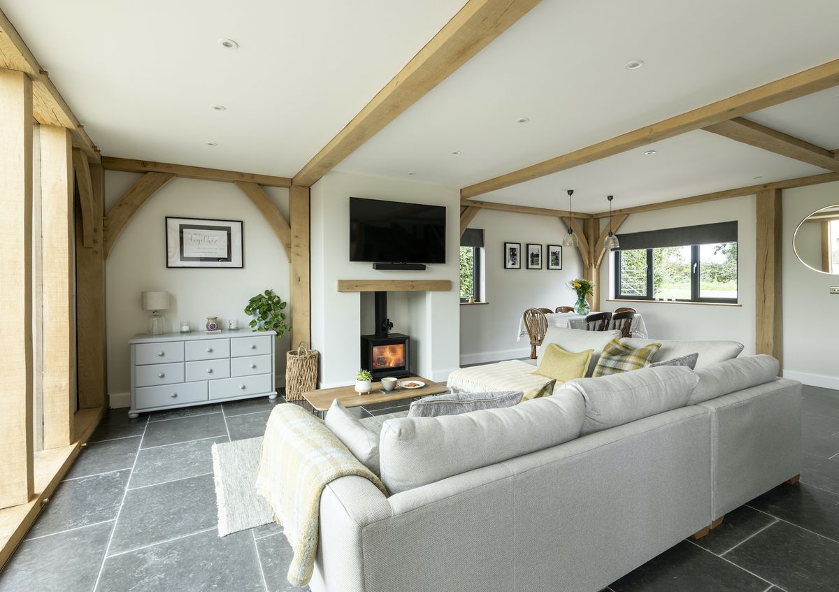 A woodburner from Stovax sits at the heart of the largely open-plan living area and supplements the underfloor heating, supplied by Pro Screed, on chilly winter evenings.