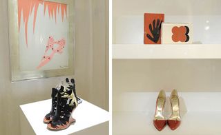White wall background, white viewing platform, three images of ladies shoes, picture frame on the wall