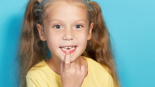 young girl who has lost her front tooth