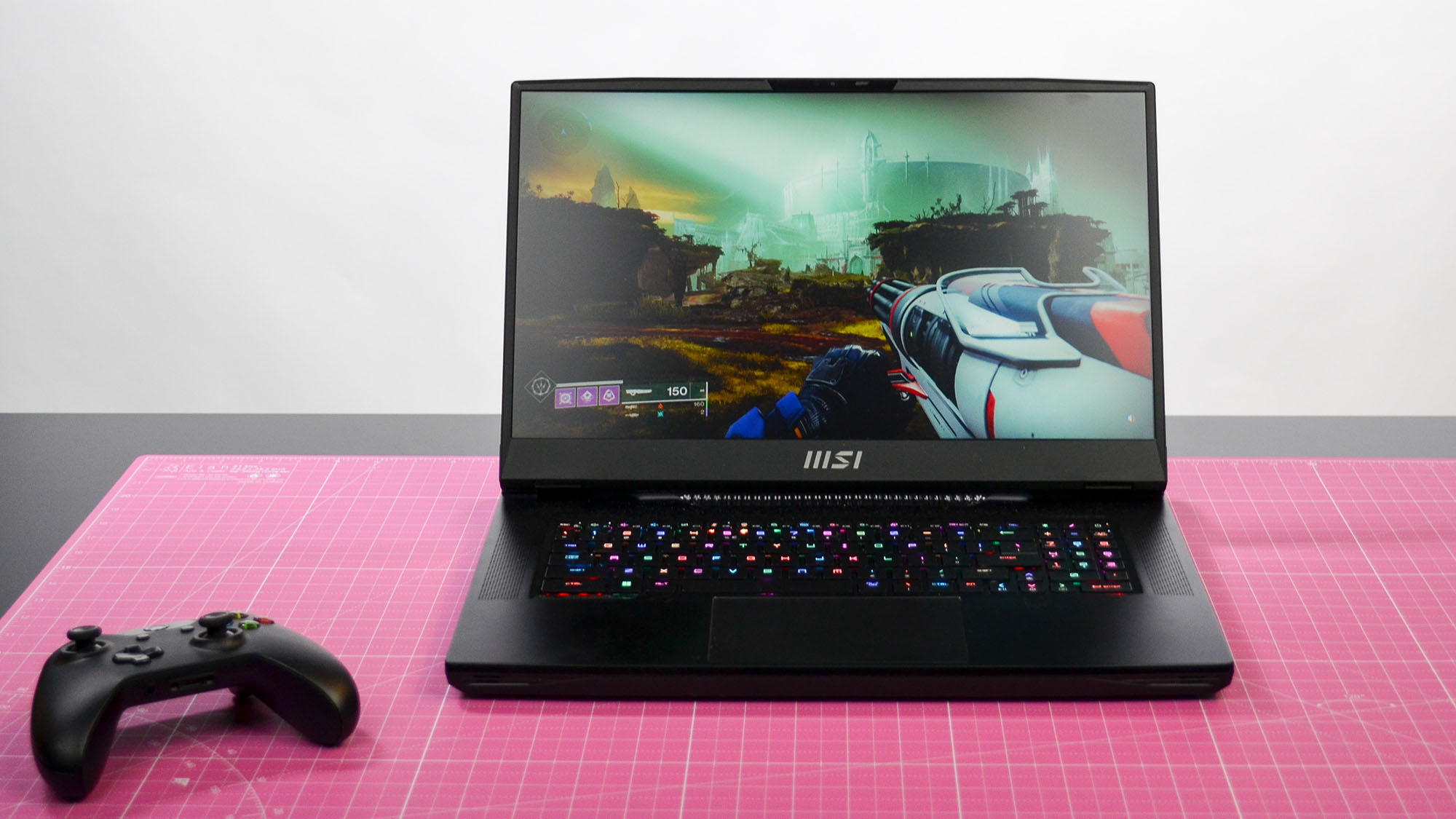 An MSI GT77 Titan on a pink desktop mat