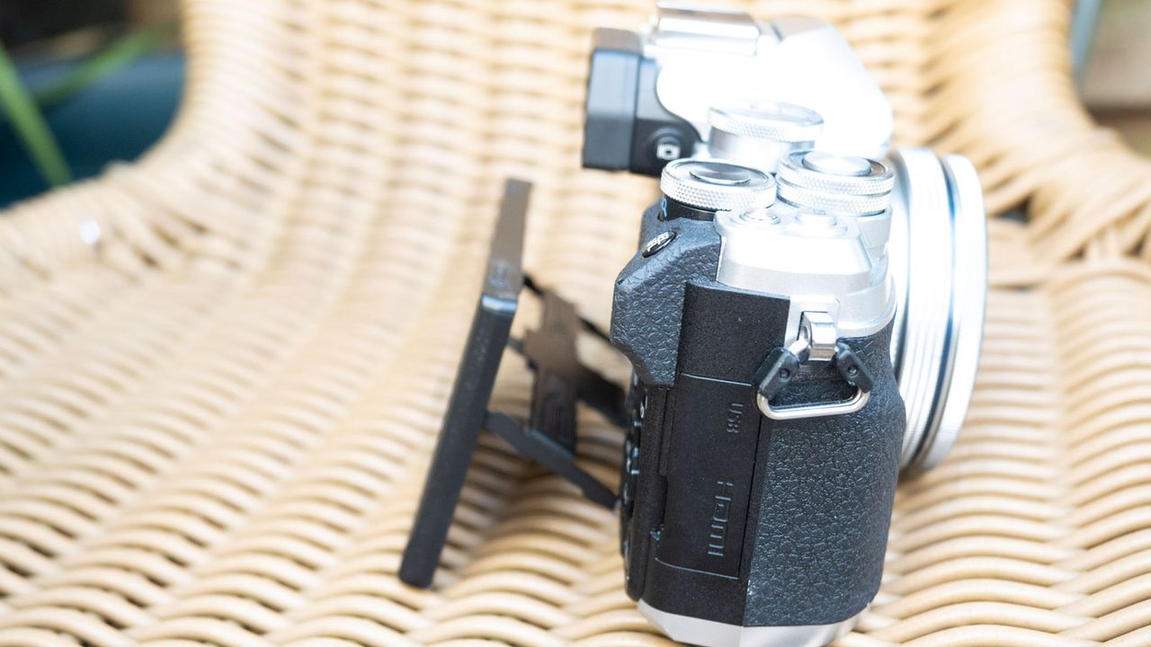 Olympus OM-D E-M10 Mark IV side profile with screen tilted