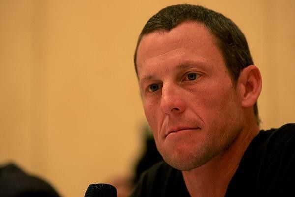 Lance Armstrong fields questions from reporters.
