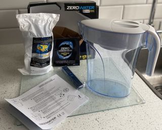 ZeroWater water filter jug on kitchen countertop with filter and instructions