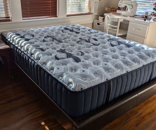 A side view of the Stearns & Foster Estate Mattress beside a dressing table.