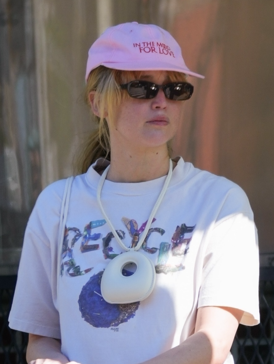jennifer lawrence wears st agni bag necklace with a vintage in the mood for love baseball cap on 4/28/2025