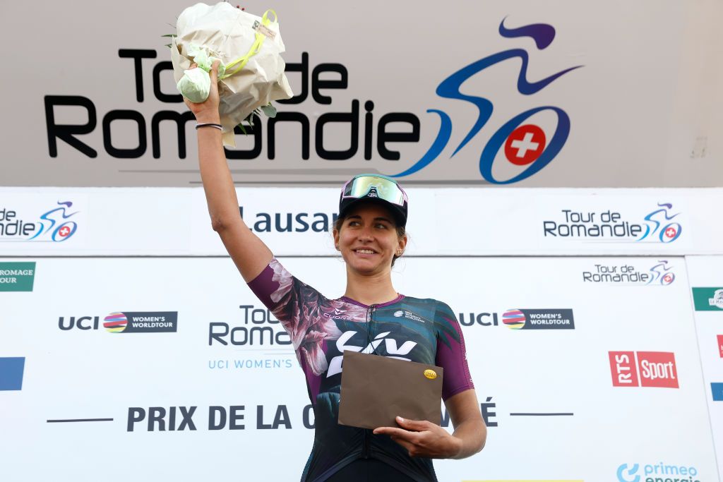 LAUSANNE SWITZERLAND OCTOBER 07 Katia Ragusa of Italy and Team Liv Racing XSTRA celebrates at podium as most combative rider prize winner during the 1st Tour de Romandie Feminin 2022 Stage 1 a 1344km stage from Lausanne to Lausanne TDRwomen TDRF on October 07 2022 in Lausanne Switzerland Photo by Bas CzerwinskiGetty Images