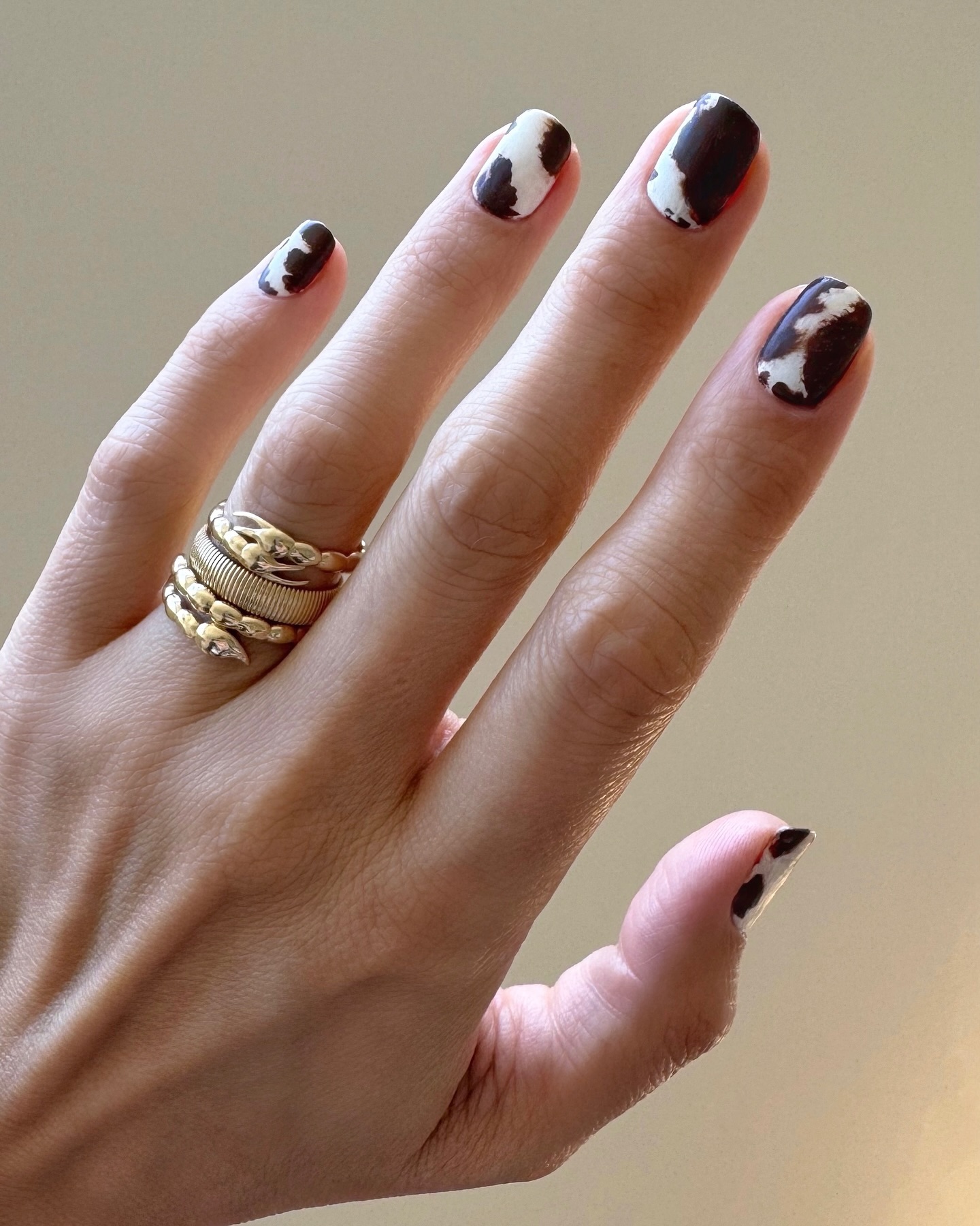 Hand-painted cow print nails by Betina Goldstein
