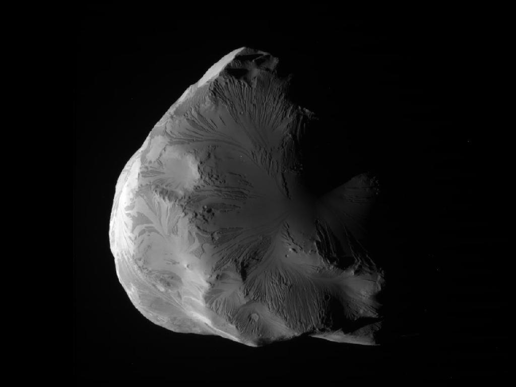 NASA&#039;s Cassini spacecraft snapped this photo of Saturn&#039;s icy moon Helene on June 18, 2011. At closest approach, Cassini flew within 4,330 miles (6,968 kilometers) of Helene&#039;s surface.