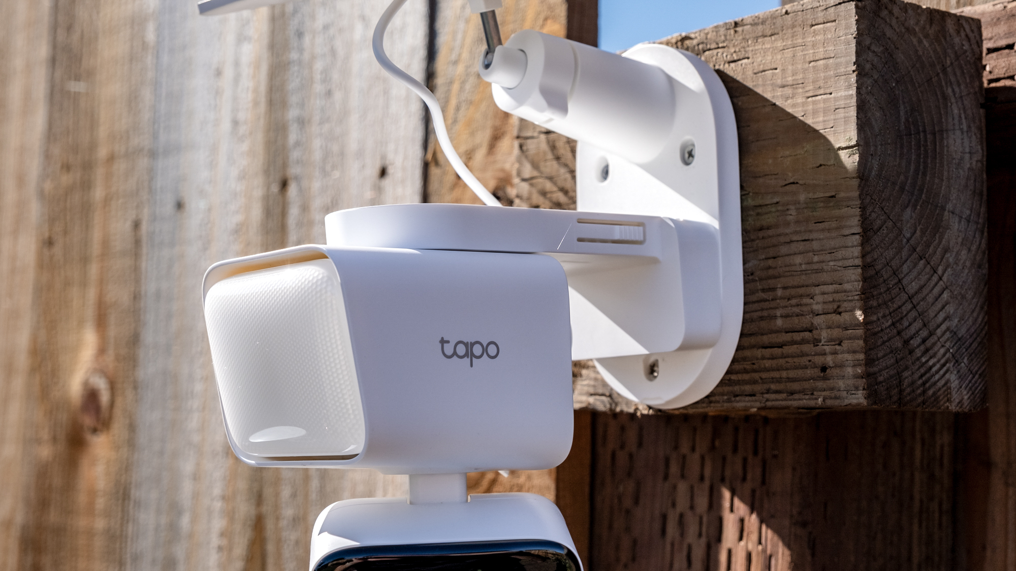 A TP Link Tapo C615F security camera mounted to a fence