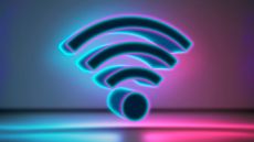Wi-Fi 8 concept image showing multi-colored 3D rendering of a Wi-Fi symbol against an illuminated backdrop.