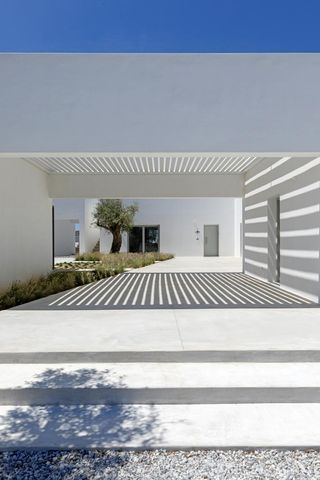 White underpass at KITE House in Greece