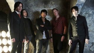 Queens Of The Stone Age posing for a photo in 2007