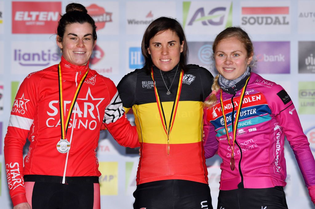 MIDDELKERKE BELGIUM JANUARY 08 LR Silver medalists Marion Norbert Riberolle of Belgium gold medalists Sanne Cant of Belgium and bronze medalists Laura Verdonschot of Belgium pose on the podium during the medal ceremony after the 105th Belgian National Cyclocross Championships 2022 Womens Elite bkmiddelkerke on January 08 2022 in Middelkerke Belgium Photo by Luc ClaessenGetty Images