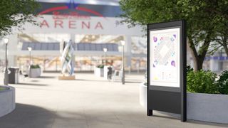 A Chief LED outdoor kiosk display stands outside a building labeled ARENA.