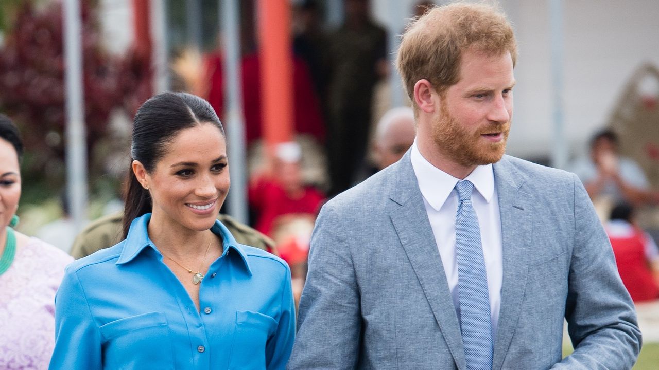 Prince Harry and Meghan Markle walk hand in hand