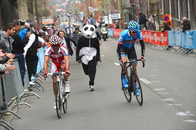 Rodriguez sits up as Dan Martin comes over to him on the final push for the line