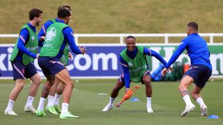 Raheem Sterling, Tyrone Mings, Jack Grealish, and Kyle Walker of England train with a rubber chicken on Saturday, June 12, during the England training session ahead of Sunday's Euro 2020 Group D match between England and Croatia.