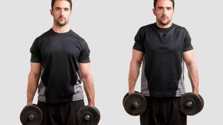 Personal trainer holding two dumbbells performing a dumbbell shrug against grey backdrop
