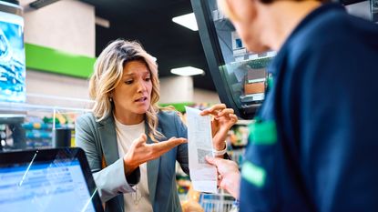 A displeased customer disputes an item on her grocery receipt with a customer service representative