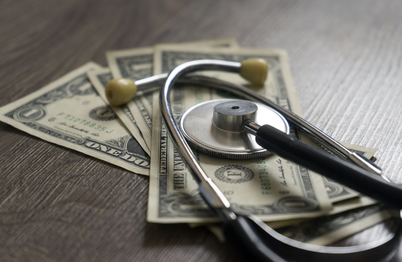 Stethoscope and money.