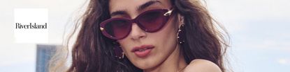 river island logo top left with a wide close up shot of a woman in sunglasses