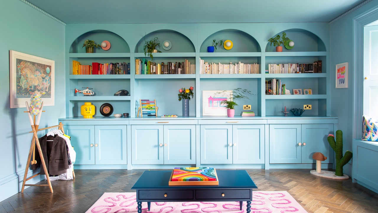 built in alcove and dresser in dining room. The walls are drenched in pale blue