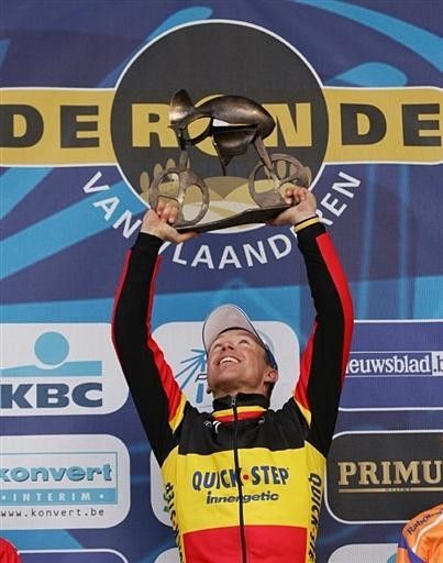 Devolder holds up the trophy - one of the most coveted mantle decorations in Belgium.