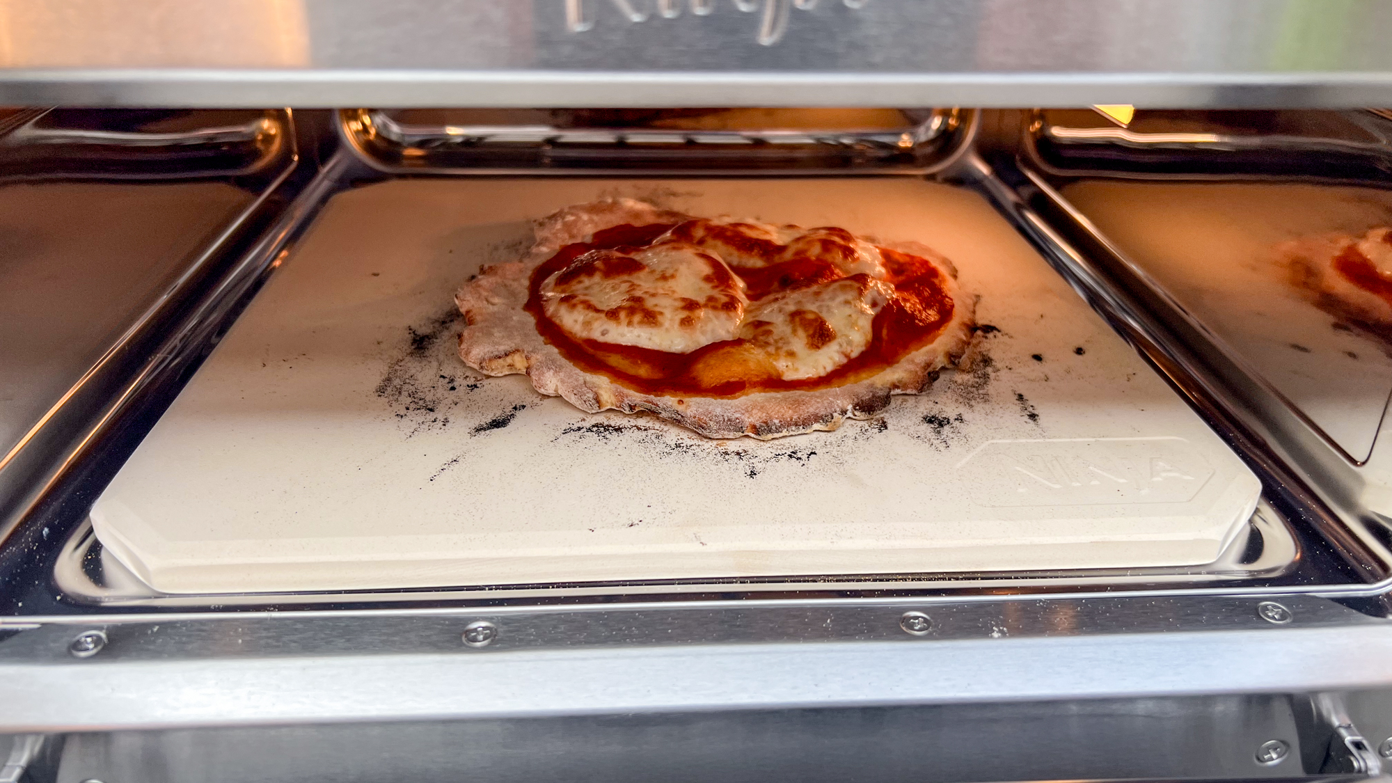 Ninja Artisan Outdoor Pizza Oven in a back yard